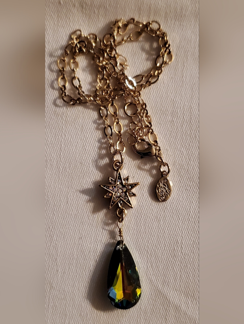 Kirks Folly Gold Starburst Pendant Necklace with Black Teardrop